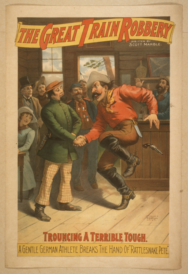 Plakat, das eine Gruppe von Menschen auf einem Boden zeigt, einer hält eine Waffe in der Hand, mit einem Fenster und einer Wand im Hintergrund und dem Text "The Great Train Robbery - Trouching a Terrible Tough" oben und unten.