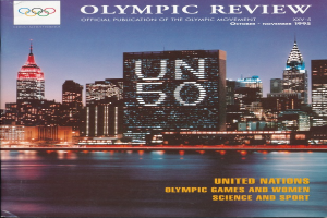 Ein Buch mit dem Titel "Olympische Revue Offizielle Veröffentlichung der Olympischen Bewegung" mit einer Stadtansicht auf dem Cover, das auf einer flachen Oberfläche liegt.