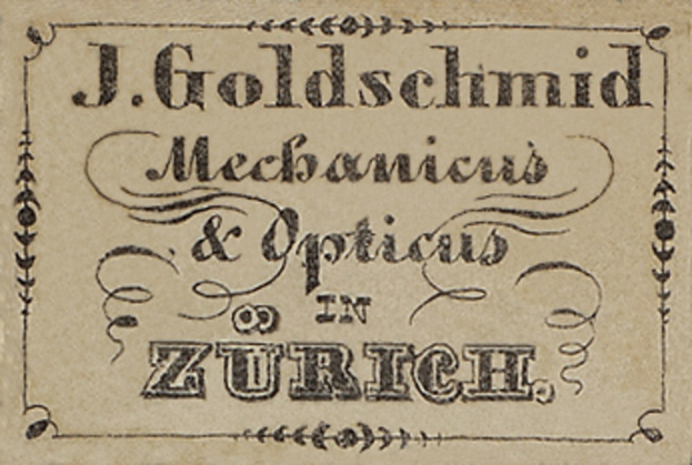 Alte Visitenkarte für "J. Goldschmidt Mechanicus & Optics in Zürich" aus dem frühen 20. Jahrhundert, die die Dienstleistungen des Unternehmens auflistet.